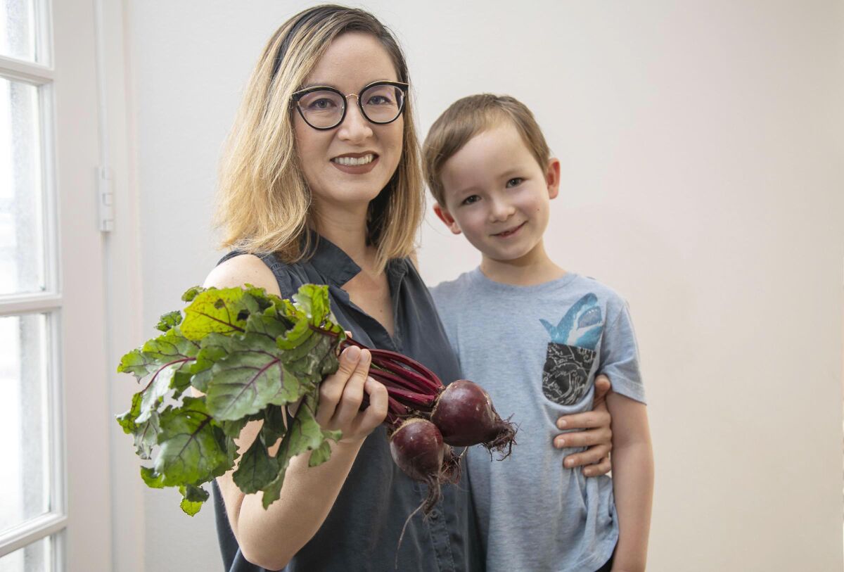 Elly Brown, executive director of the San Diego Food System Alliance, pictured here with her son, Emmet.