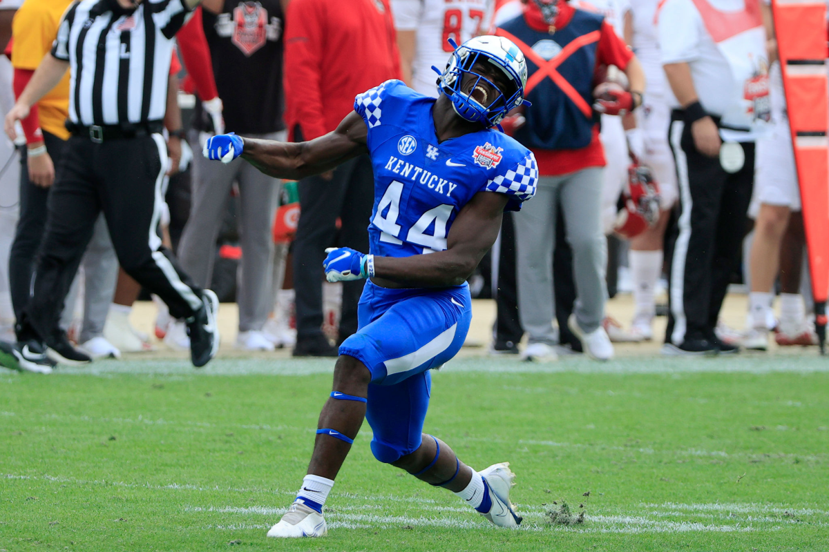 Kentucky linebacker Jamin Davis celebrates a defensive stop against N.C. State in the Gator Bowl on Saturday.