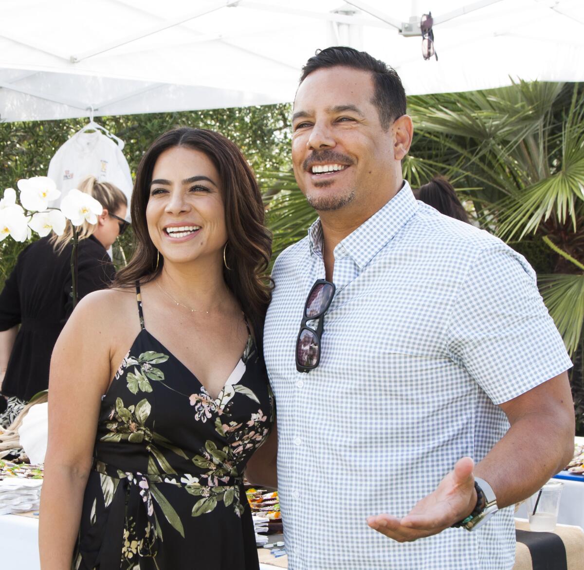 Arcely and Adrian Montero attend the annual KidWorks Summer Party in Newport Beach.