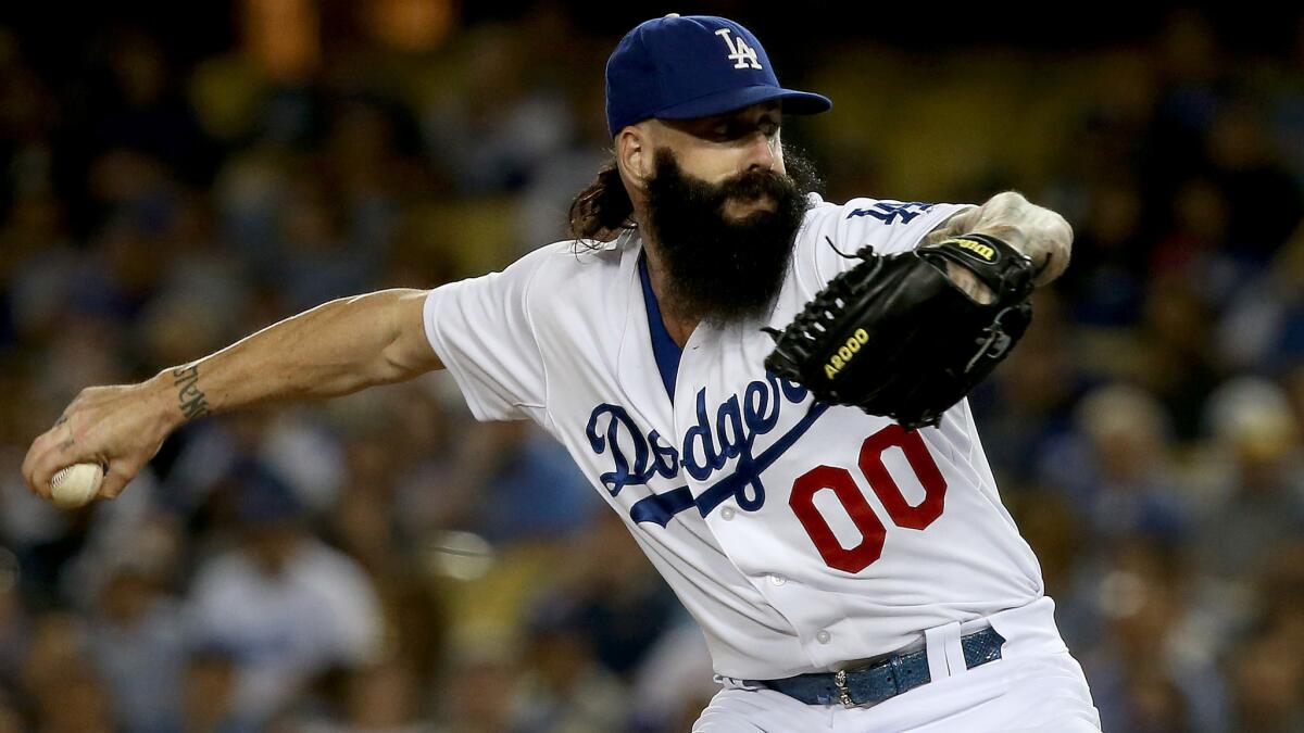 Dodgers reliever Brian Wilson delivers a pitch during a game against the St. Louis Cardinals in June 2014.