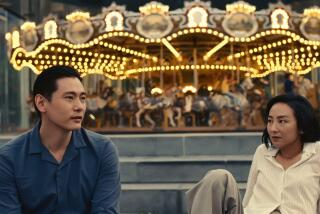 Teo Yoo and Greta Lee in the movie "Past Lives."