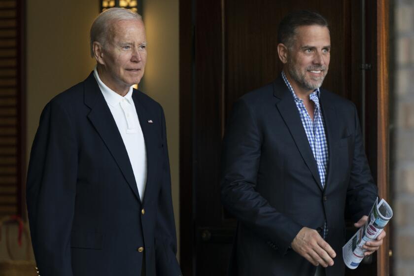 FILE - President Joe Biden and his son Hunter Biden leave Holy Spirit Catholic Church in Johns Island, S.C., after attending a Mass on Aug. 13, 2022. Biden is in Kiawah Island with his family on vacation. An IRS special agent is seeking whistleblower protection to disclose information regarding what the agent contends is mishandling of an investigation into President Joe Biden’s son, Hunter Biden. That is according to a letter to Congress obtained by The Associated Press. (AP Photo/Manuel Balce Ceneta, File)