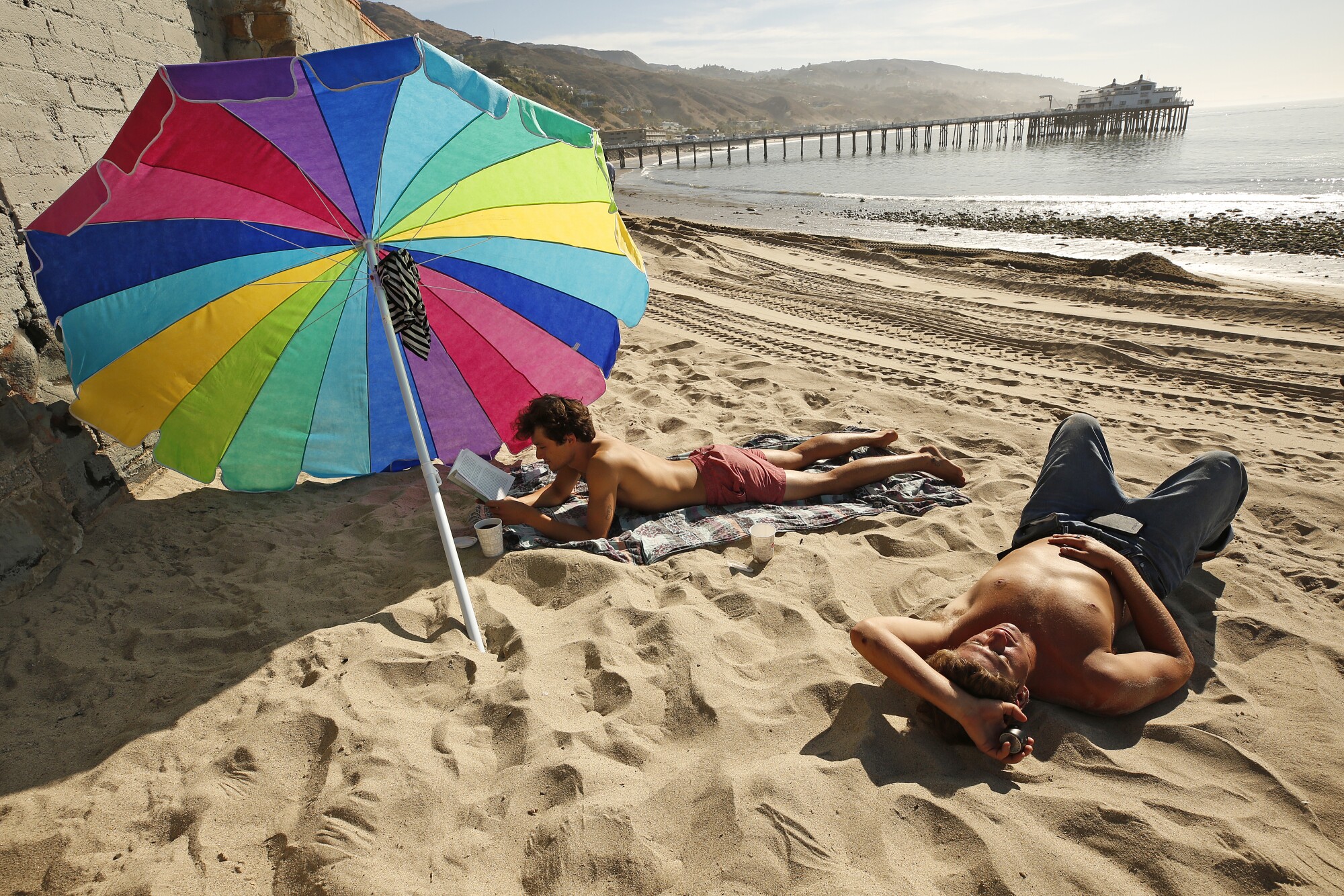 Matthew Bautista, 24, left, and friend Bobby Kraemer, 27, right, in Malibu
