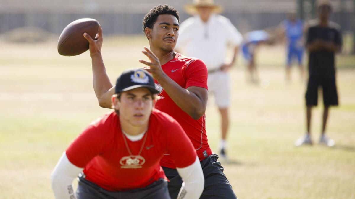 Mater Dei quarterback Bryce Young throws a pass during the Battle at the Beach summer varsity football passing league tournament at Edison High School.