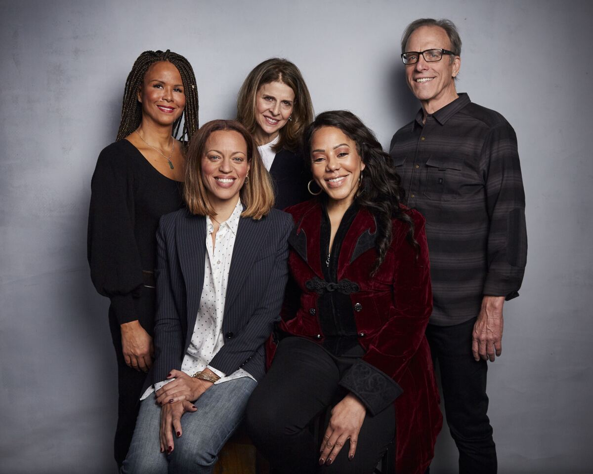 Sil Lai Abrams, from back left, director Amy Ziering, director Kirby Dick, Drew Dixon, bottom left, and Sheri Hines pose for a portrait to promote the film "On the Record" at the Music Lodge during the Sundance Film Festival on Sunday, Jan. 26, 2020, in Park City, Utah. (Photo by Taylor Jewell/Invision/AP)