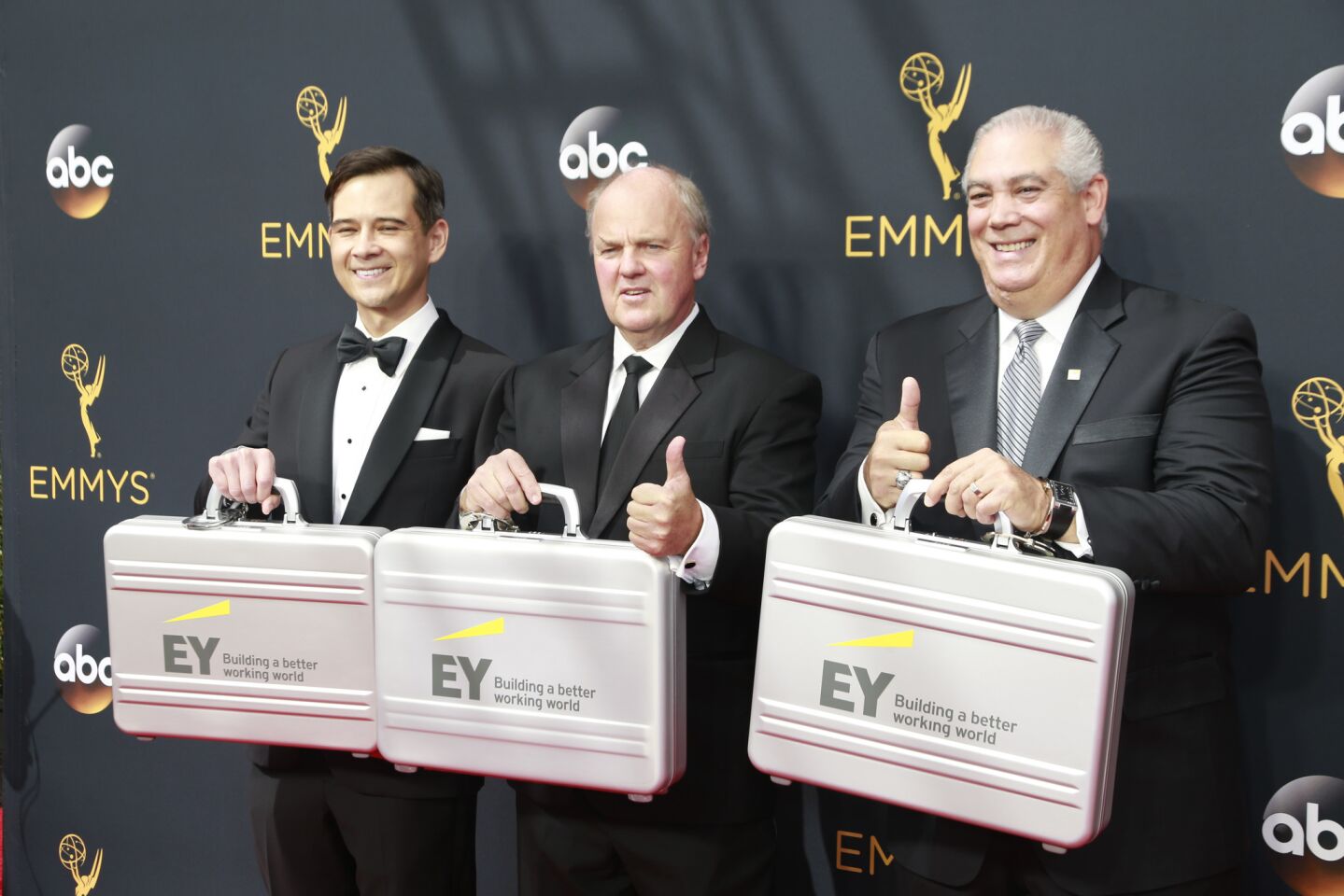 Representatives of Ernst & Young arrive with the winners at the 68th Primetime Emmy Awards at Microsoft Theater in Los Angeles.