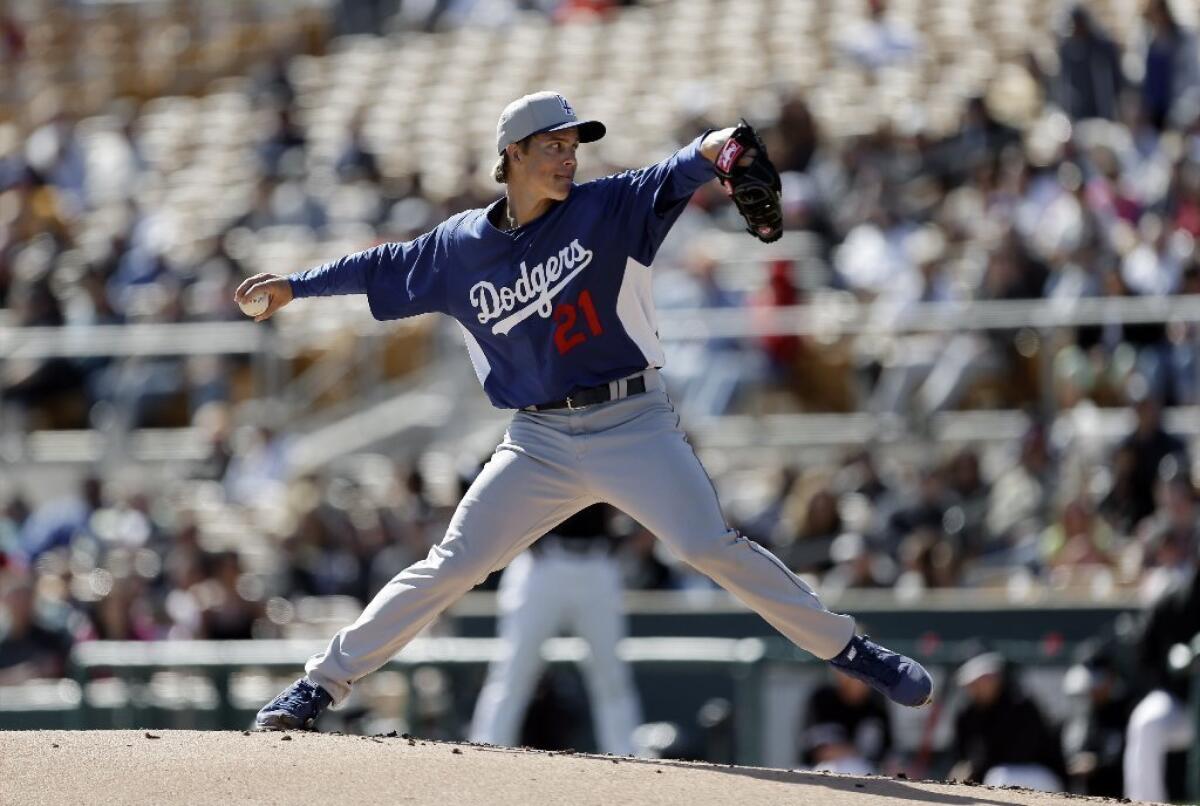 Zack Greinke pitches against the Chicago White Sox in the first inning of a Feb. 24 exhibition game.