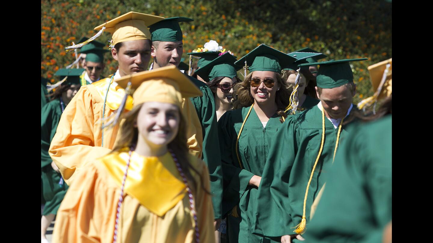 Edison High School graduates enter the stadium all smiles as they make their way to the Class of 2017 Commencement Ceremony at OCC on Thursday.