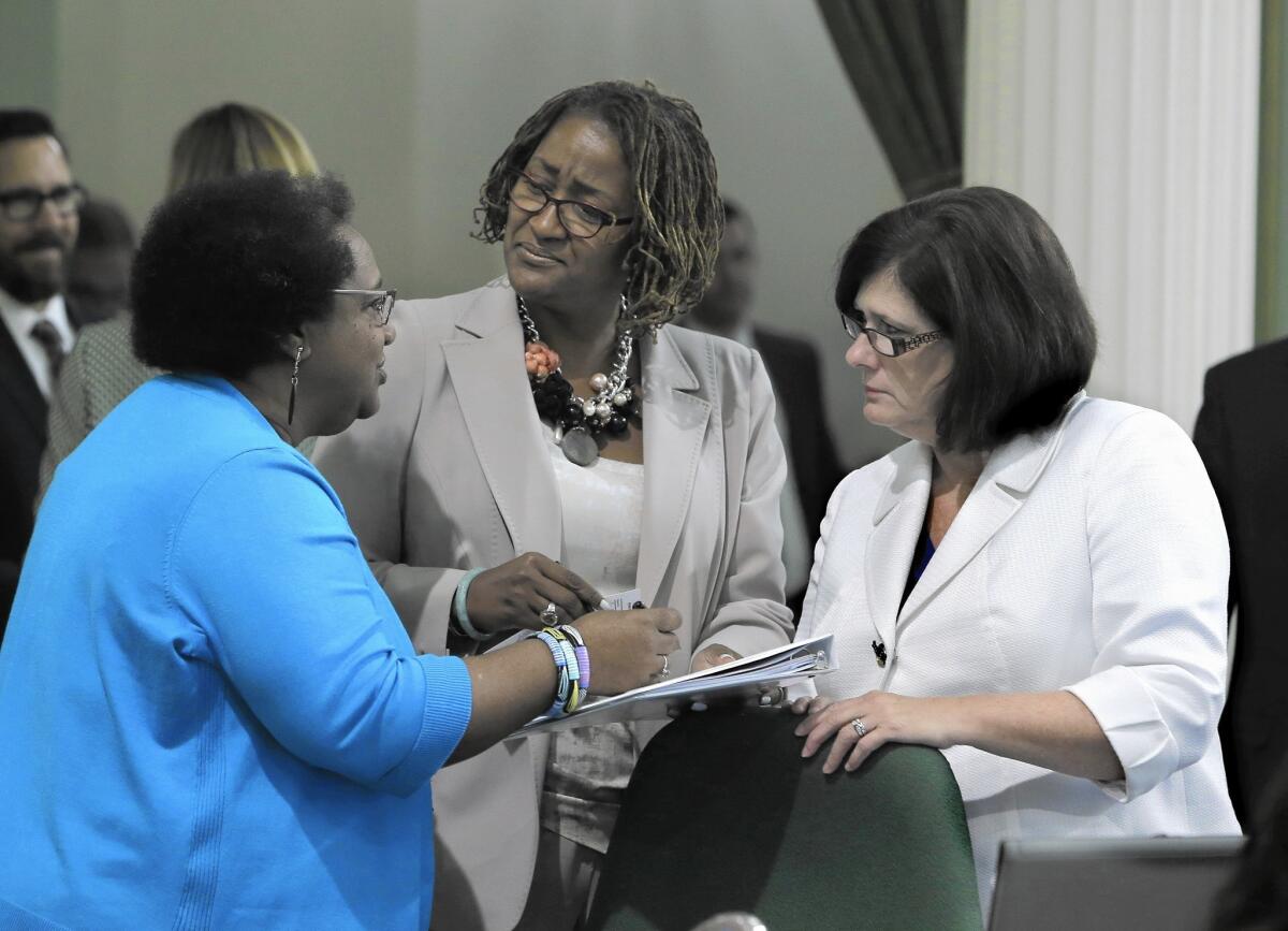Assemblywoman Shirley Weber (D-San Diego), left, discusses legislation with Sen. Holly Mitchell (D-Los Angeles), center, and Assemblywoman Susan Bonilla (D-Concord).