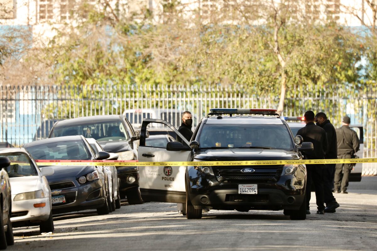 Police cars and crime-scene tape in the Vermont Square area of South L.A.