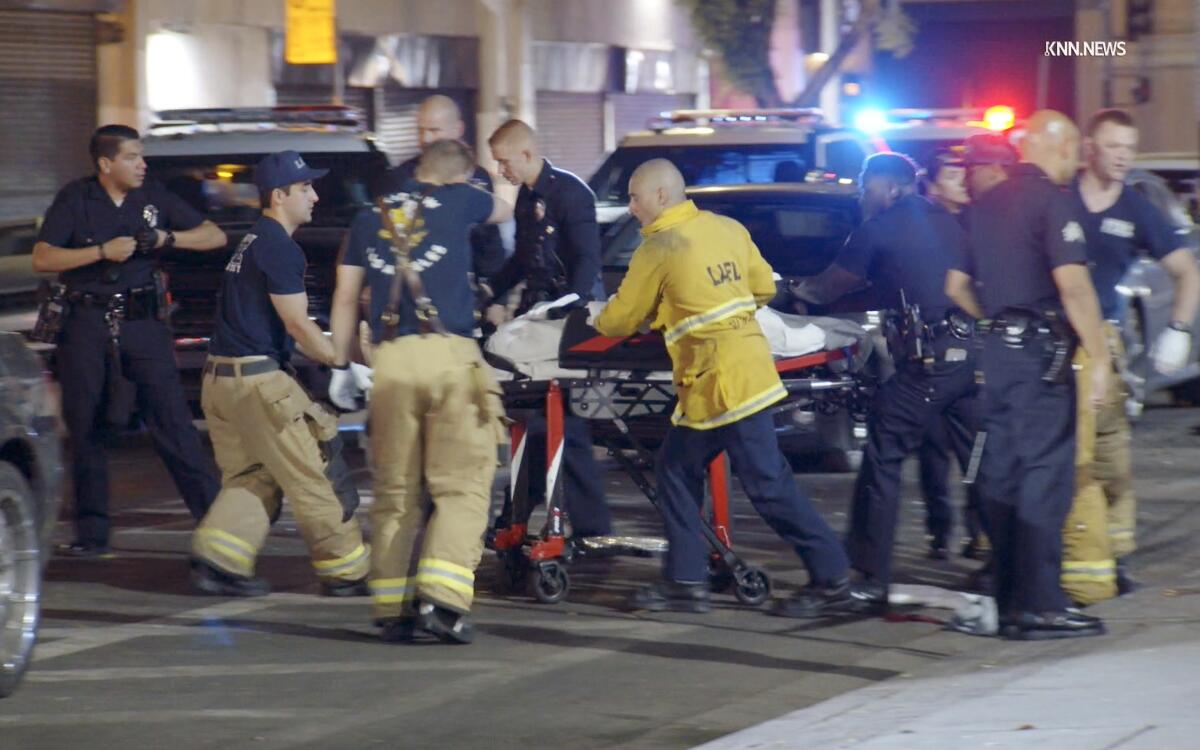 A man is transported by first responders following a stabbing in downtown Los Angeles.