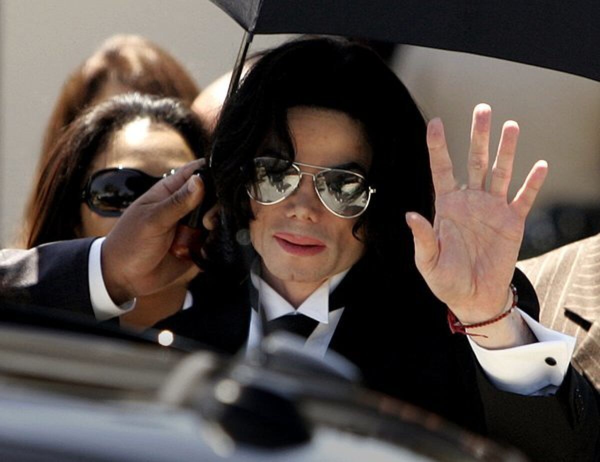 Michael Jackson walks out of a Santa Maria courthouse after being acquitted on all 10 counts in a child-molestation case.
