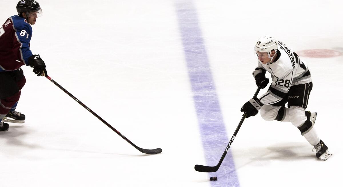 Kings center Jaret Anderson-Dolan skates with the puck.