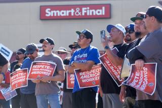 Members of Smart & Final Warehouse Workers, holding signs protest during a press conference outside Smart & Final Super Market in Burbank, California, on Wednesday August 16, 2023. More than 600 Smart & Final warehouse workers recently became members of Teamsters Local 630 accuse parent company Mexican-Owned Grupo CHEDRAUI, USA given working, pay, and safety conditions create by the company since they took ownership. The company announced expansion plans and plans create wage disparities as company announces expansion plans in the Western States. (Photo by Ringo Chiu / For The Times)
