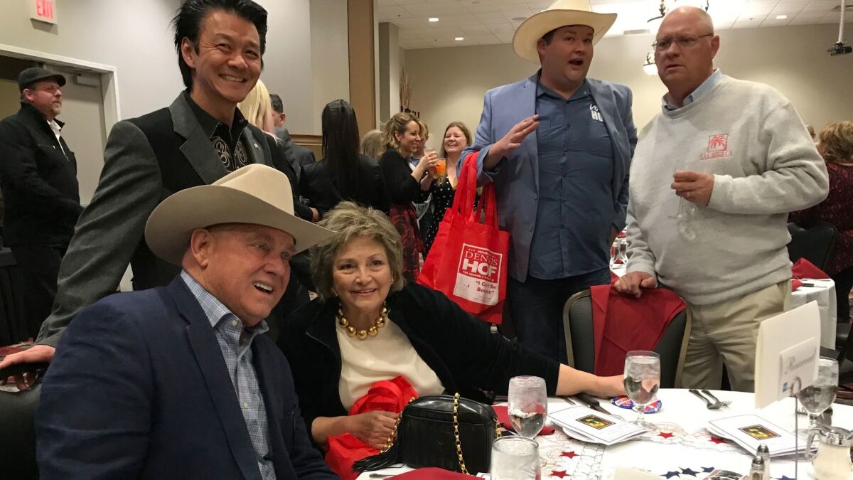 Dennis Hof, seated at left, joins a group at the 39th Lincoln Day Dinner hosted by the Pahrump Valley Republican Women and Nye County Republican Central Committee.