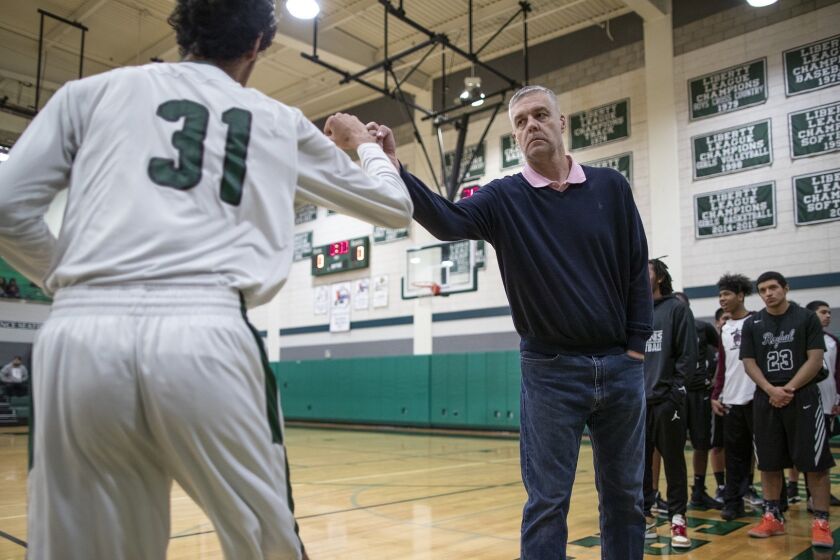 BURBANK, CA, TUESDAY, FEBRUARY 27, 2019 - Roybal High School basketball coach Danny O'Fallon during pregame introductions at a state tournament game against Providence. He led his team to a 19-0 record and the LA City championship while battling stage four cancer. (Robert Gauthier/Los Angeles Times)