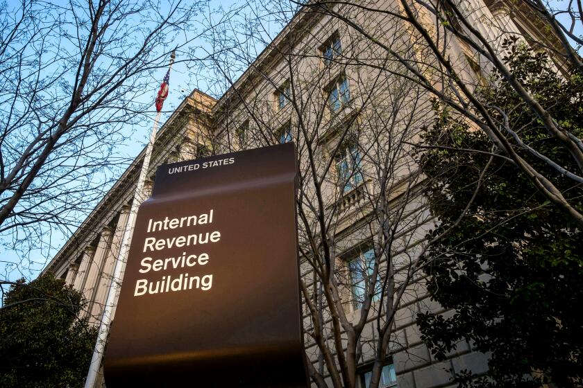 FILE - This April 13, 2014, file photo shows the Internal Revenue Service (IRS) headquarters building in Washington. The Treasury Department and the IRS are urging taxpayers who want to get their economic impact payments directly deposited to their bank accounts to enter their information online by Wednesday, May 11, 2020. The IRS said that people should use the “Get My Payment” tool on the IRS website by noon on Wednesday to provide their direct deposit information. (AP Photo/J. David Ake, File)