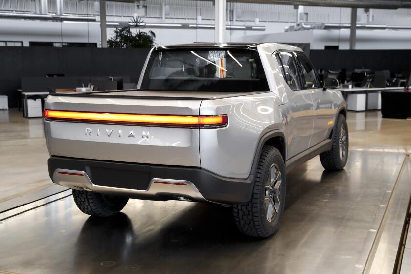 FILE - In this Nov. 14, 2018, photo shows Rivian R1T at Rivian headquarters in Plymouth, Mich. Rivian, an Electric vehicle startup backed by Amazon, Ford, and other deep-pocketed investors, confidentially filed to become a publicly traded company this week, Friday, Aug. 27, 2021. Rivian said that the initial public offering is expected to take place after the Securities and Exchange Commission completes its review process. (AP Photo/Paul Sancya)
