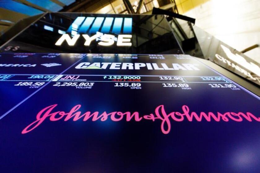 A screen shows the logo for the pharmaceutical company Johnson and Johnson on the floor of the New York Stock Exchange in New York, New York, USA, 29 May 2019 (reissued 26 August 2019). EFE/EPA/Justin Lane