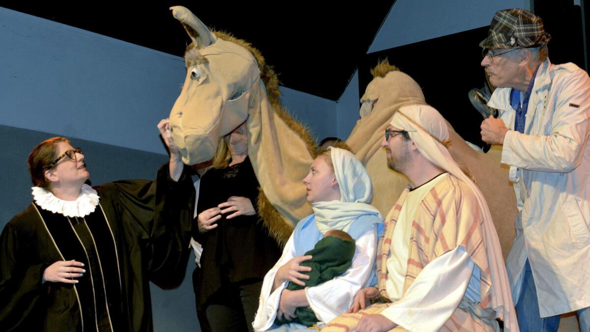 You know it's not going to be a traditional Christmas pageant when Ruth Bader Ginsburg, played by Megan Gerig, from left, visits Mary and Joseph, portrayed by Nevada Brandt and David Kalpakian, as Inspector Clouseau, played by Glenn Boggs, looks on.