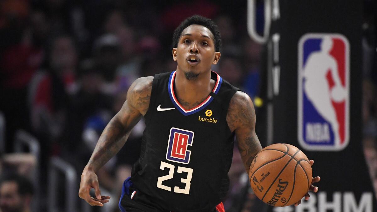 Clippers guard Lou Williams handles the ball against the Nuggets on Feb. 28, 2020.