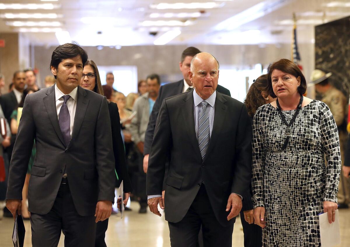 Senate leader Kevin de Leon (D-Los Angeles), left, and Assembly Speaker Toni Atkins (D-San Diego), right, are pushing a new budget that includes more spending than Gov. Jerry Brown wants.