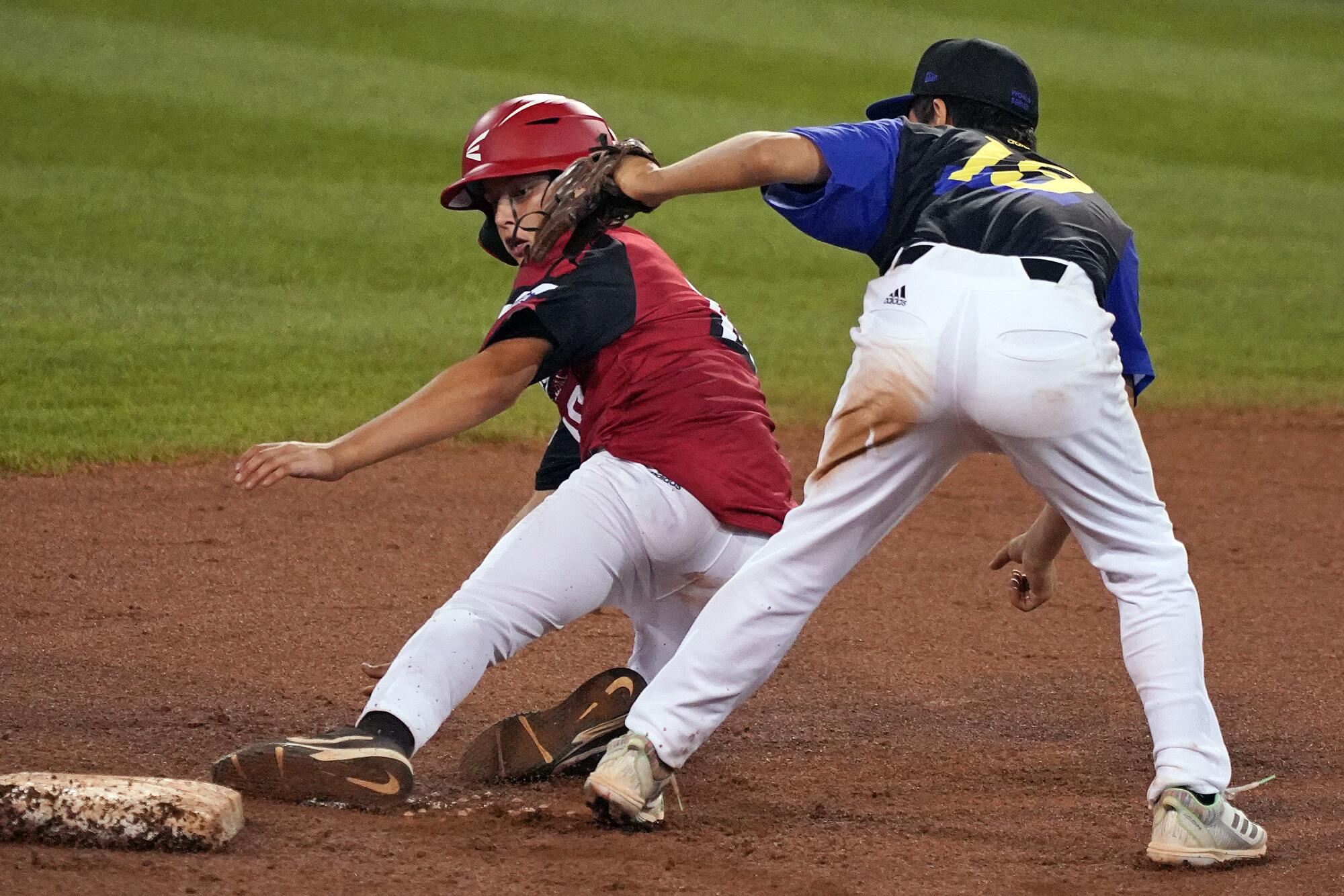 Hamilton, Ohio's Chance Retherford, left, steals second under the tag  by Torrance's Gibson Turner.