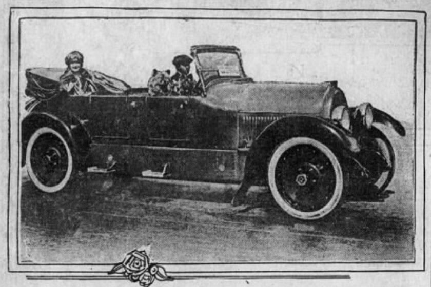 Clara Kimball Young is seen in her open-top custom limo with her dogs