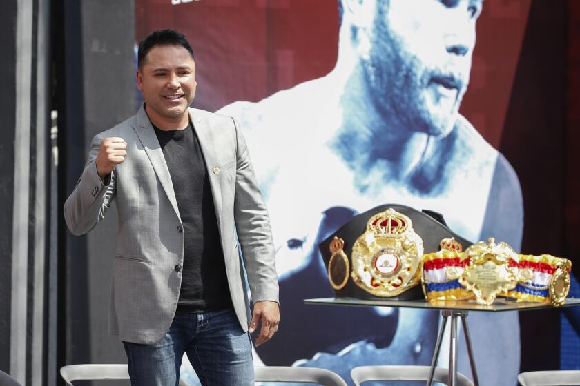 Retired Mexican boxer and Golden Boy Promotions, Inc. founder Oscar De La Hoya, pumps his fist during a pre-fight press conference in Mexico City, Friday March 1, 2019. WBC and WBA middleweight world champion Canelo Alvarez (50-1-2, 34 KOs), and IBF middleweight world champion Daniel Jacobs (35-2, 29 KOs) meet in a 12-round unification bout in Las Vegas, Nevada, on Saturday May, 4, 2019. (AP Photo/Anthony Vazquez)