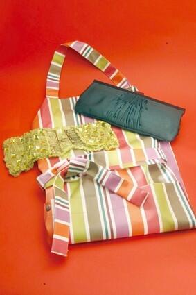 Oilcloth apron from Jean-Vier, $39.99; Hoss clutch from Camille DePedrini, $155; sparkly stretch belt from Angeli, $25.