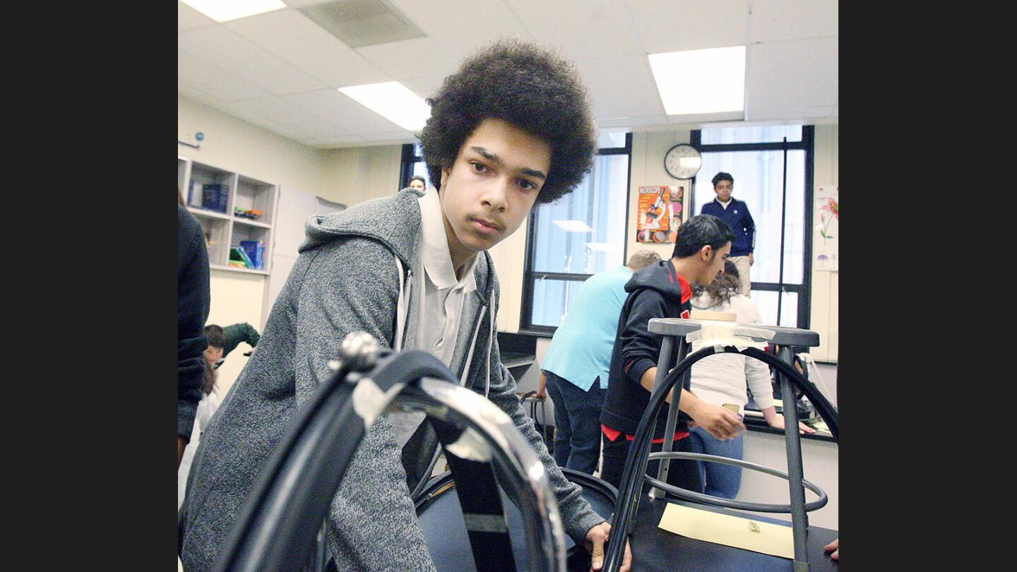 Photo Gallery: 8th grade Theodore Roosevelt Middle School students make roller coasters in physical science class