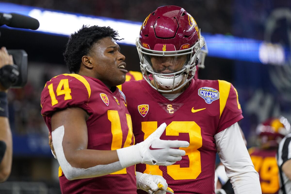 USC running back Raleek Brown (left) is congratulated by quarterback Caleb Williams after a touchdown