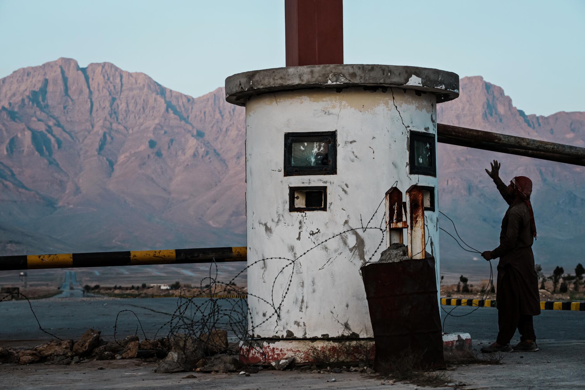 A sentry post pockmarked with bullet holes at the entrance to the 350-acre, $216-million, industrial park near Kabul.