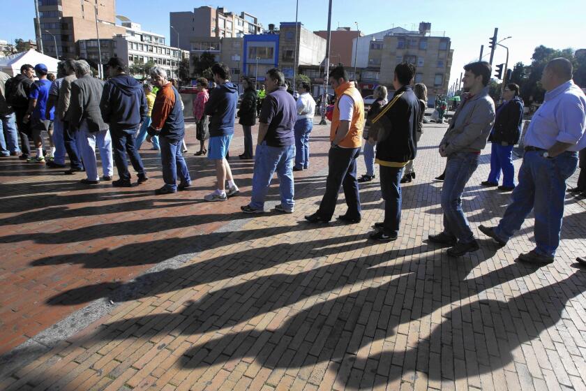 Voters wait for their turn at the ballot box in Bogota, the Colombian capital.