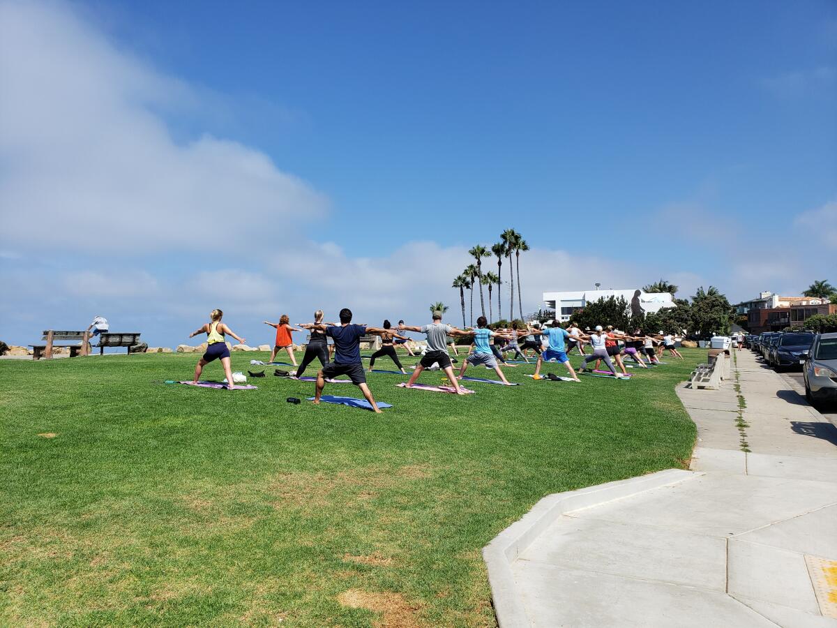 A yoga class is held at Calumet Park in La Jolla's Bird Rock.