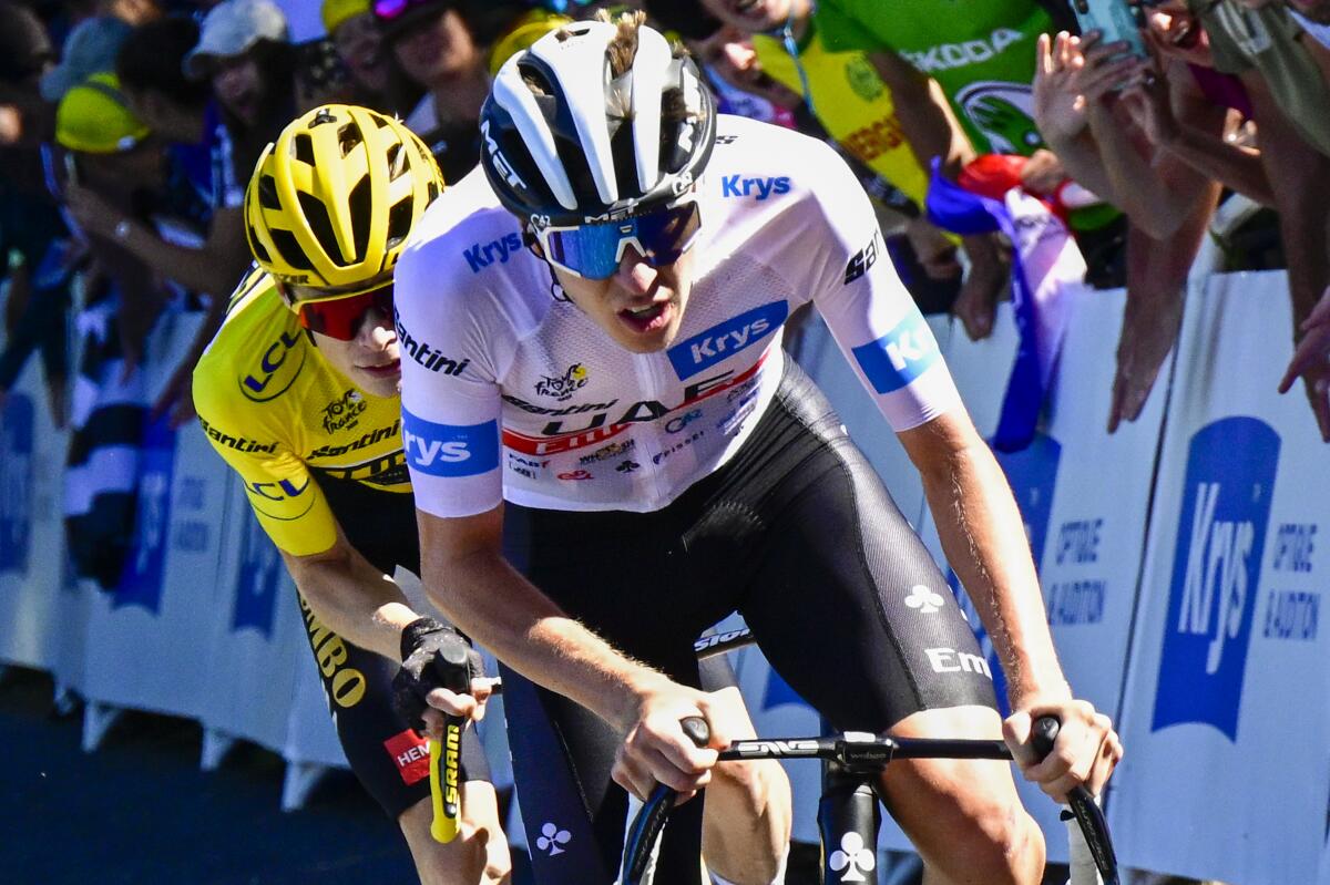Tadej Pogacar tries to break away from Jonas Vingegaard during the Tour de France.