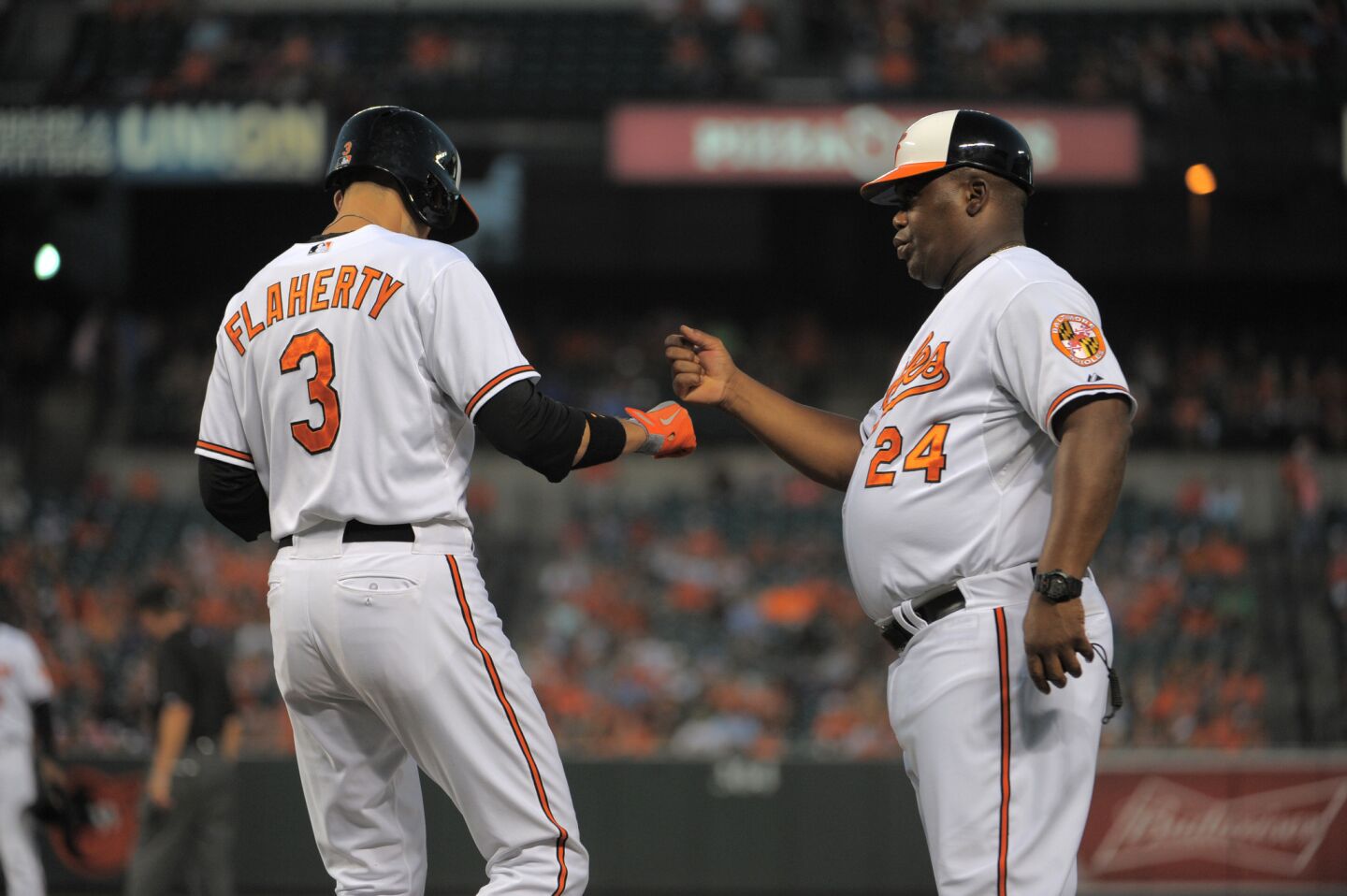 Baltimore Orioles players including Ryan Flaherty (3), Manny Machado (13),  and Steve Pearce (28) celebrate the