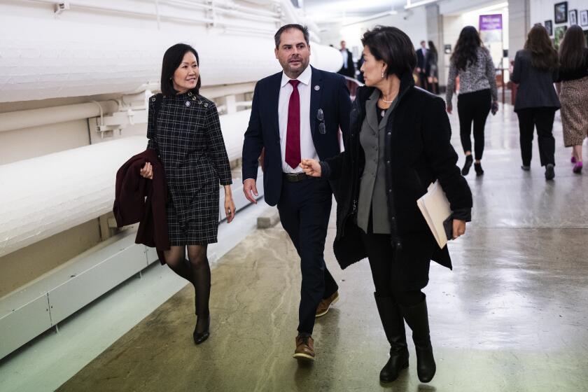 UNITED STATES - NOVEMBER 30: From left, Reps. Michelle Steel, R-Calif., Mike Garcia, R-Calif., and Young Kim, R-Calif., are seen in the Cannon tunnel during a vote on Wednesday, November 30, 2022. (Tom Williams/CQ-Roll Call, Inc via Getty Images)