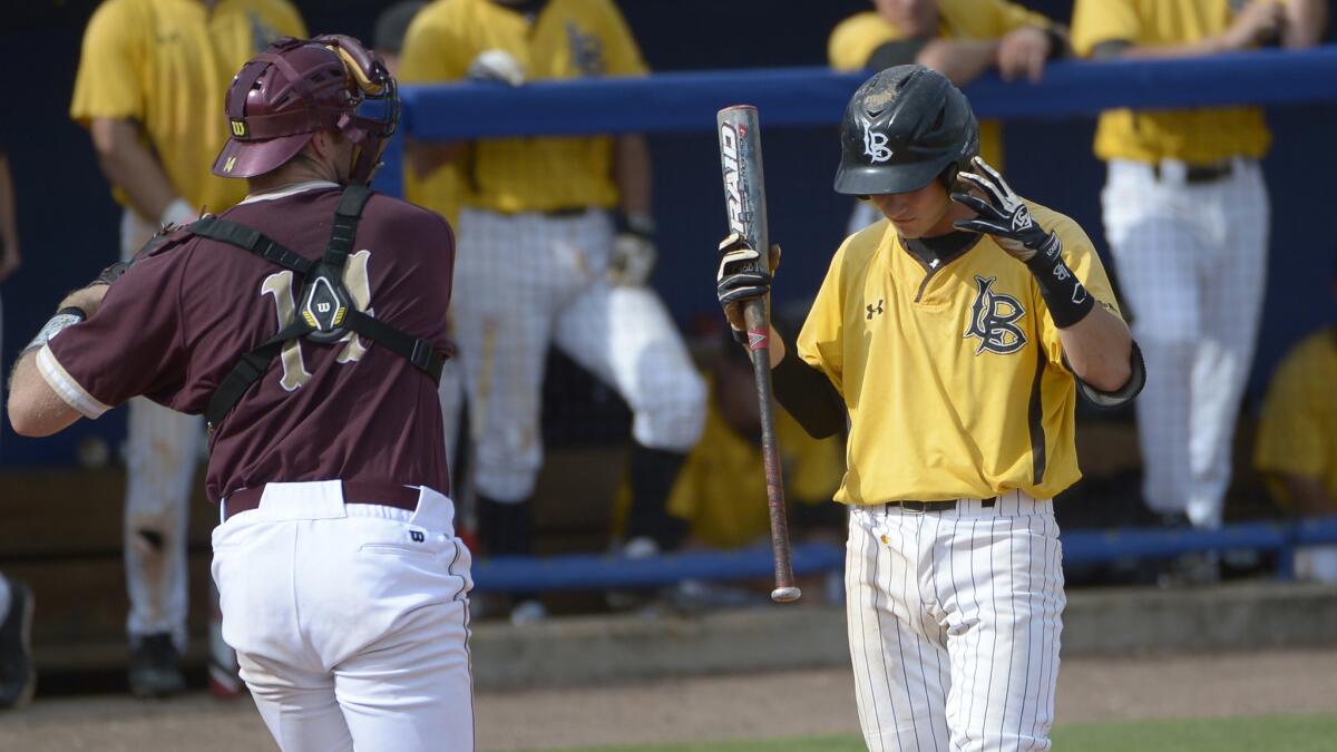 Long Beach State's Garrett Hampson, right, reacts after striking out in front of College of Charleston catcher Ryan Welke during the 49ers' 4-2 loss in the NCAA regionals Monday.