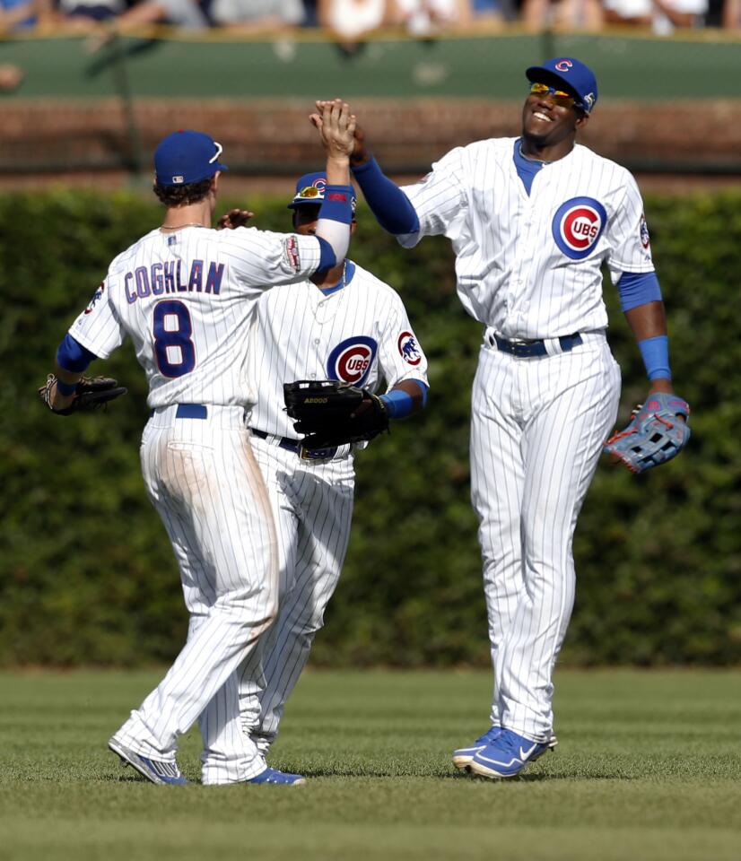 Chris Coghlan, Arismendy Alcantara and Jorge Soler after the final out against the Brewers.