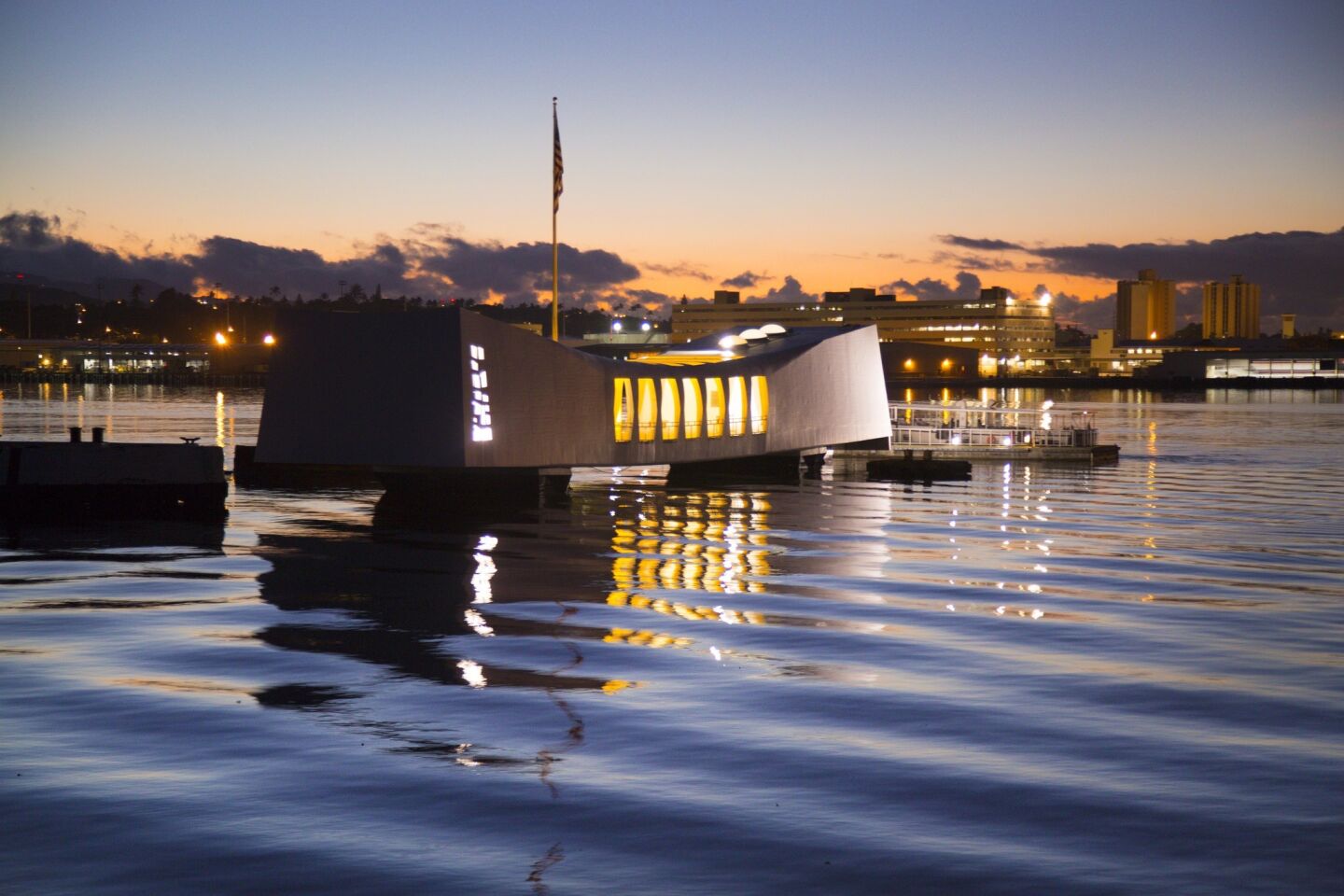 The sun prepares to rise behind the battleship USS Arizona Memorial at Pearl Harbor Hawaii, as commemorations continue leading up to Wednesday, the 75th anniversary of the Japanese attack on Pearl Harbor, December 7, 1941, thrusting The United States into World War II.