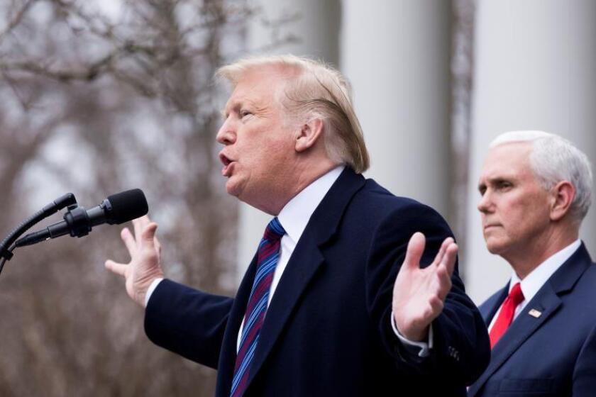 US President Donald Trump (l.) holds a press conference beside Vice President Mike Pence (r.) in the White House Rose Garden on Dec. 4, 2019, during which he threatened to declare a national emergency that would allow him to order construction of a border wall with Mexico without Congressional approval of the needed funds. EFE-EPA/Michael Reynolds