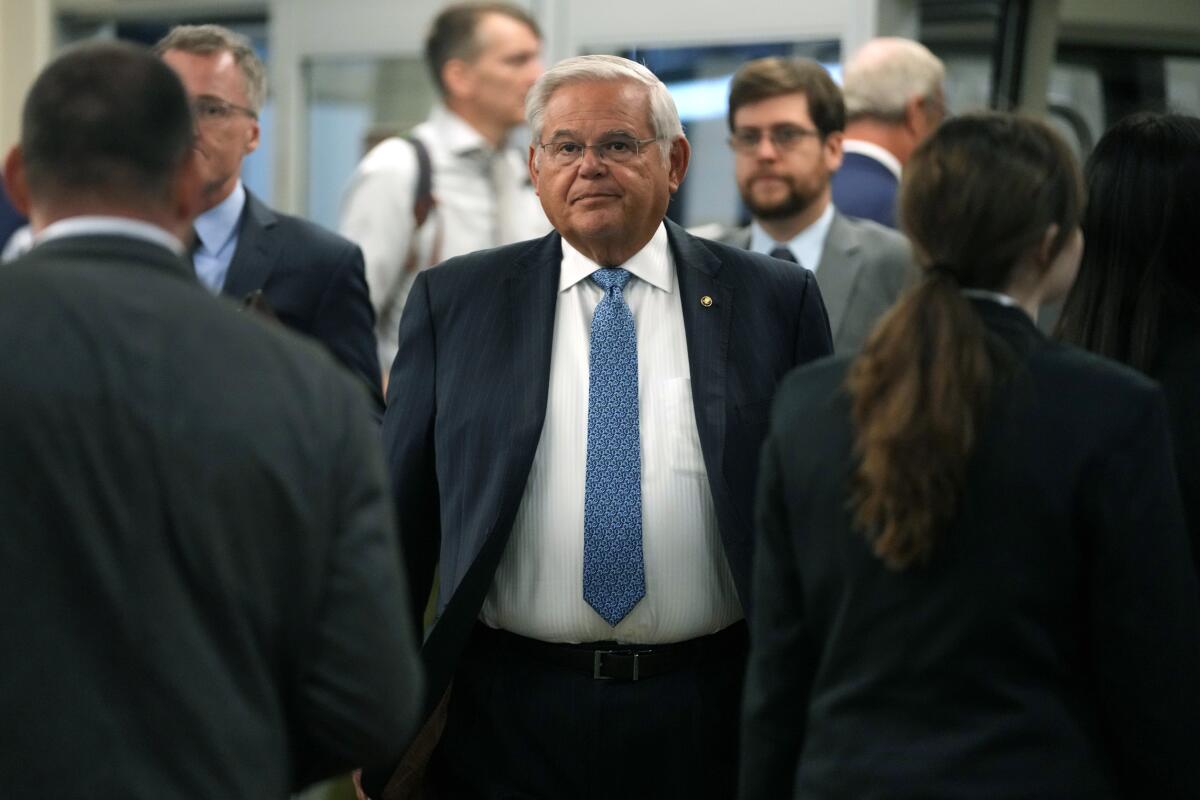 Sen. Bob Menendez walks through the Capitol.