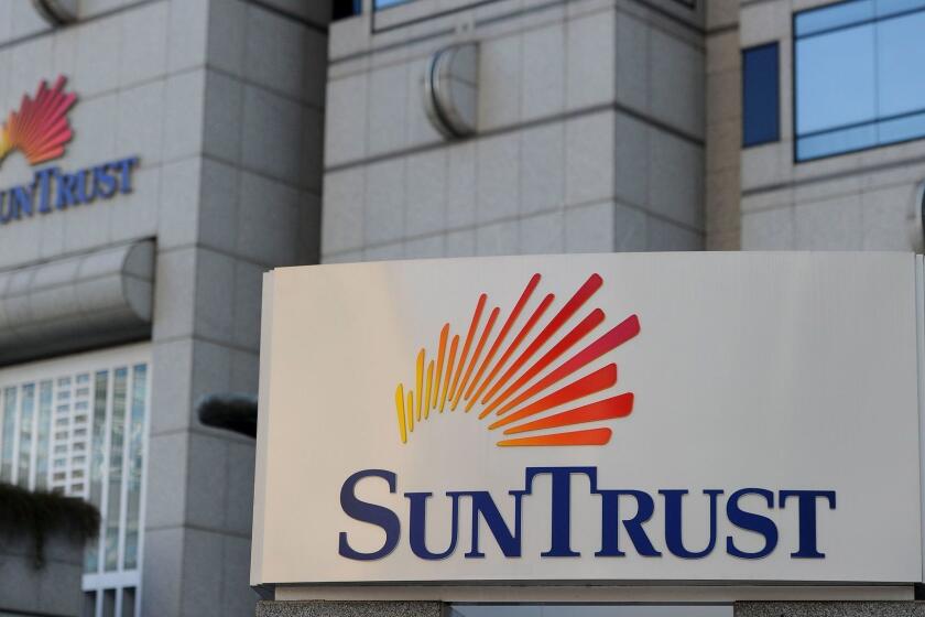 Mandatory Credit: Photo by ERIK S LESSER/EPA-EFE/REX (10096396a) (FILE) - The SunTrust Plaza, the headquarters for SunTrust Bank, is seen in Atlanta, Georgia, USA, 15 March 2012 (reissued 07 February 2010). Media reports on 07 February 2010 state SunTrust and BB&T banks are to merge in a 66 billion USD deal, creating a bank with 442 billion USD in assets. Both banks said the merger would enable them to save net costs of some 1.6 billion USD by 2022. BB&T chairman and chief executive Kelly King is to keep his title and position in the merged entity until 2021 when SunTrust chief William Rogers takes over as group chied executive. SunTrust, BB&T banks merge, Atlanta, USA - 15 Mar 2012 ** Usable by LA, CT and MoD ONLY **