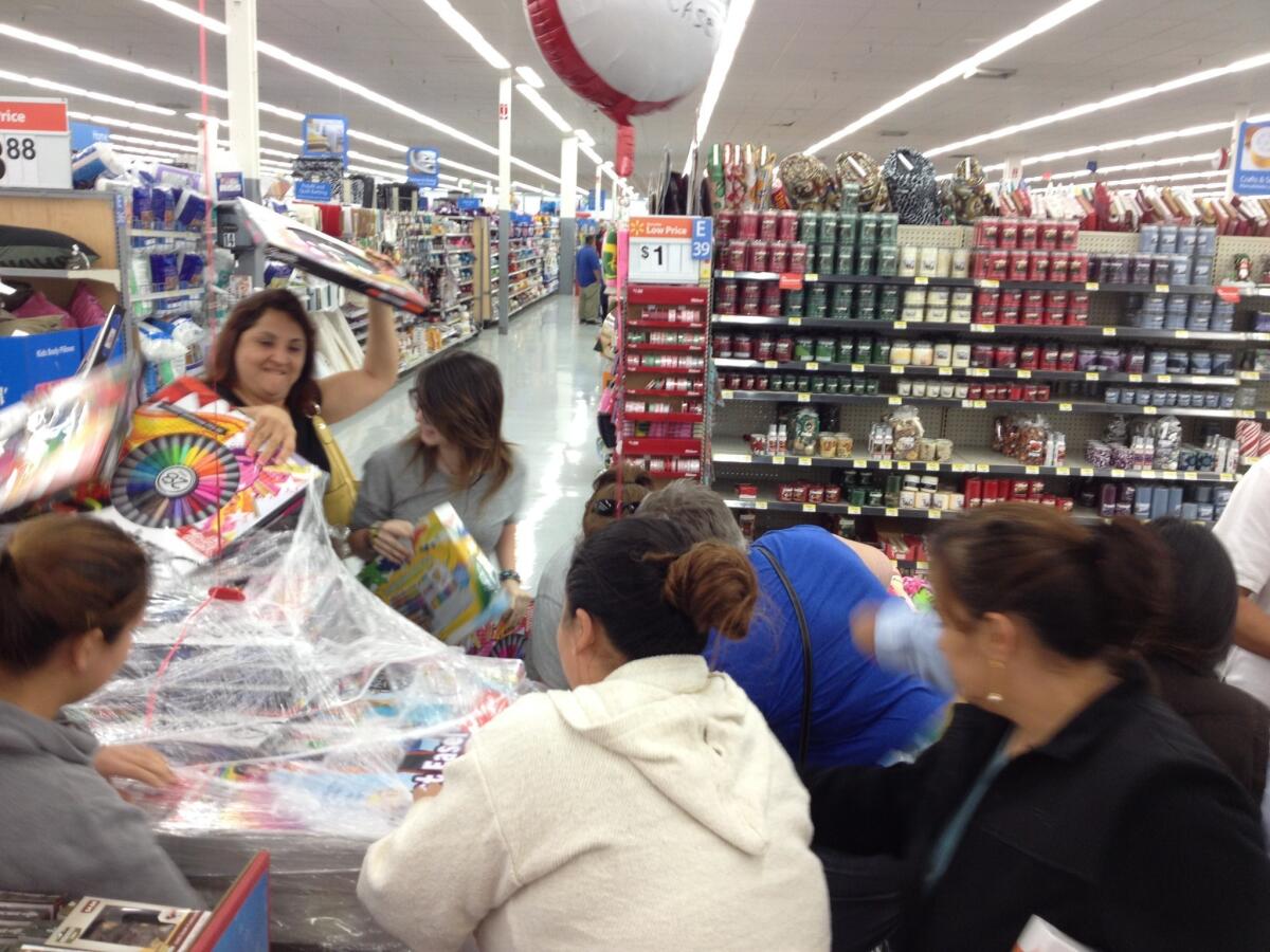 Shoppers at a Wal-Mart in Duarte on Thanksgiving scramble for Crayola crayon sets marked down to $11 from nearly $20.