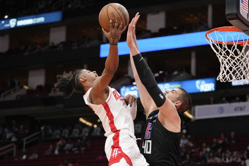 Houston Rockets guard Jalen Green (0) shoots as Los Angeles Clippers center Ivica Zubac defends during the first half of an NBA basketball game, Sunday, Feb. 27, 2022, in Houston. (AP Photo/Eric Christian Smith)