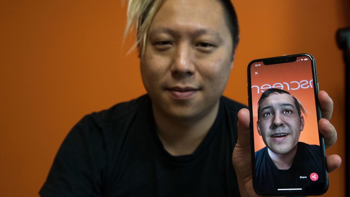 Pinscreen's Hao Li uses the app to superimpose another face onto his body.