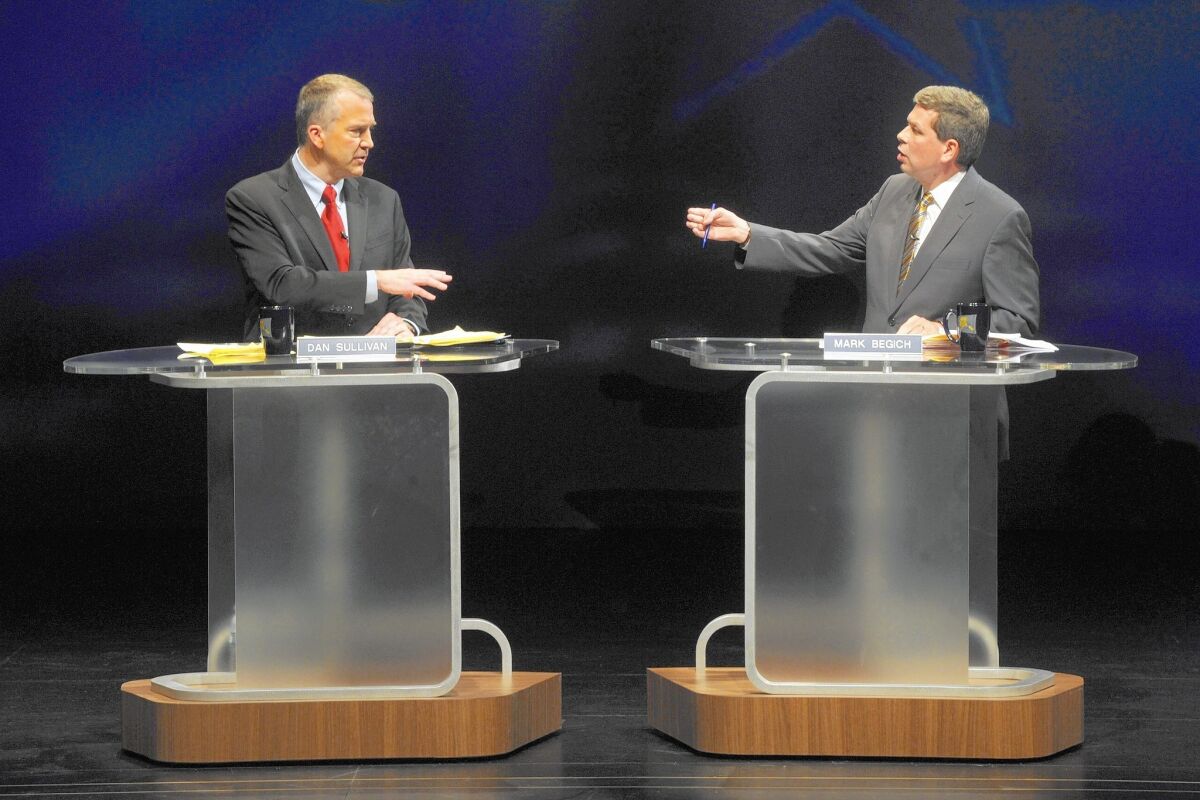 Republican Dan Sullivan, left, and Democratic Sen. Mark Begich spar during a debate this month.