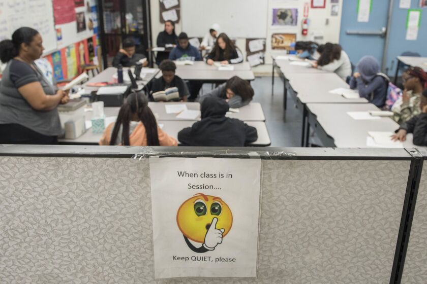 TORRANCE CA APRIL 22, 2019 -- Students at Magnolia Science Academy 3 learn in a makeshift classroom created by using dividers in the school's office space on the campus of Curtiss Middle School in Carson on Monday April 22, 2019. Magnolia Science Academy 3, a charter school operating on the Curtiss campus is hoping to use some of the school's unused classrooms for their students. (Photo by Nick Agro / For The Times)