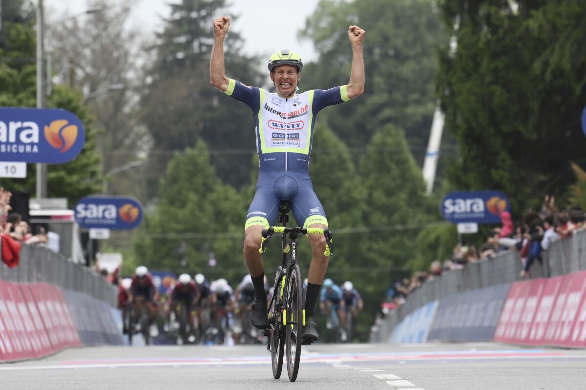 Dutch rider Taco van der Hoorn celebrates winning the third stage of the Giro d'Italia, tour of Italy cycling race from Biella to Canale, Italy, Monday, May 10, 2021. (Gian Mattia D'Alberto/LaPresse via AP)